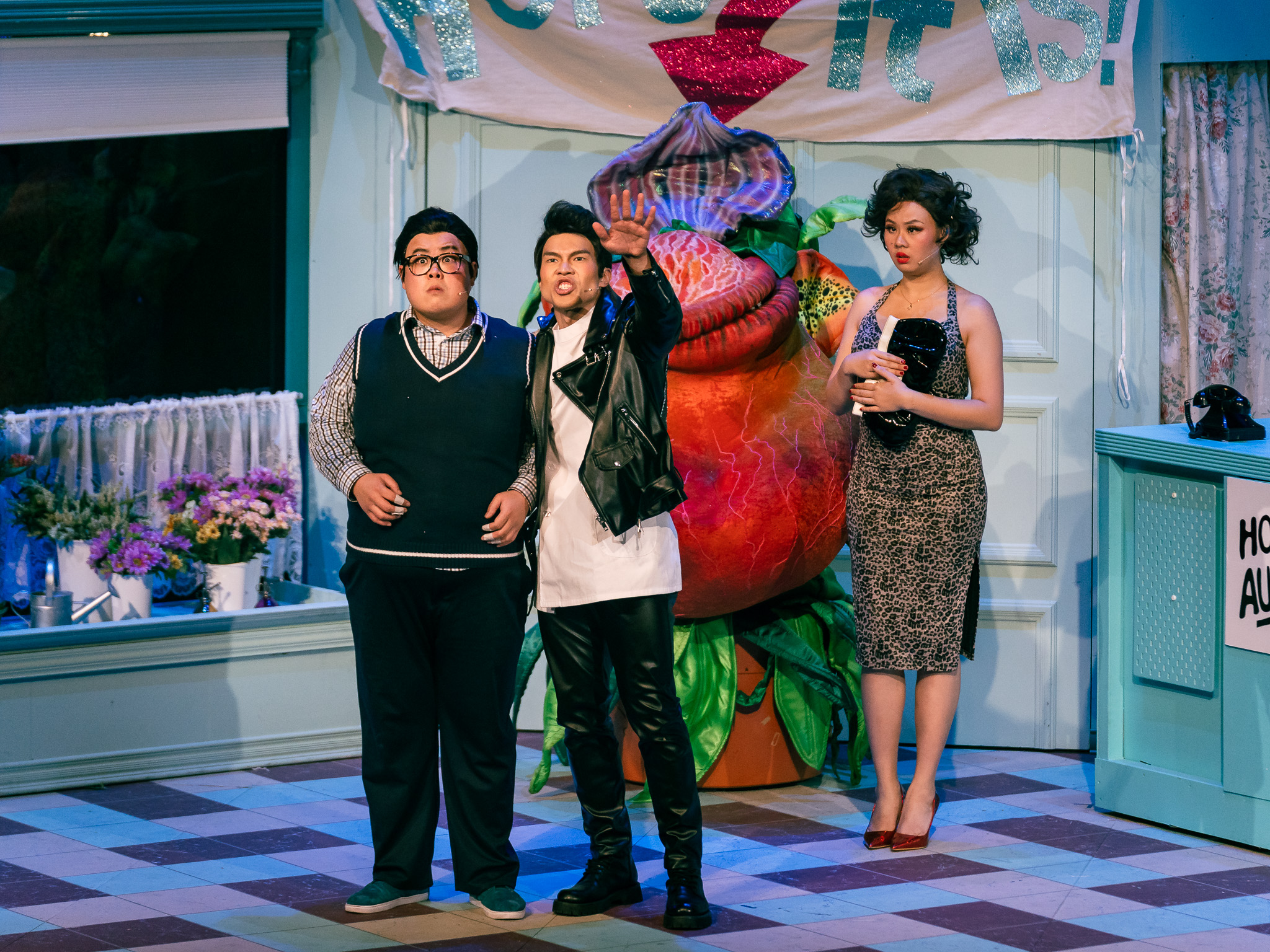 Wide shot of some of The Little Shop of Horrors cast