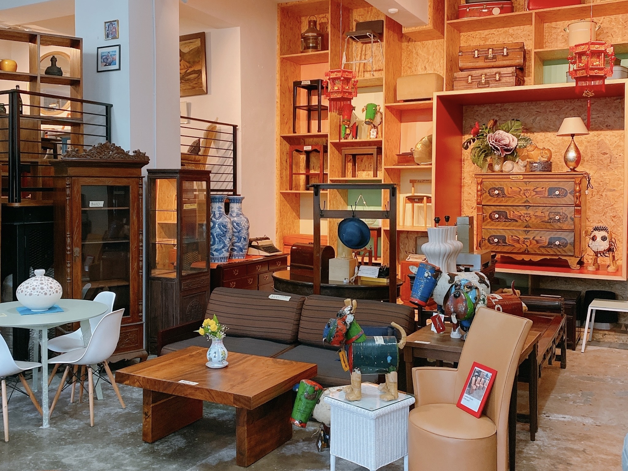 Wide shot of Hock Siong & Co.’s furniture store featuring some of their pieces 
