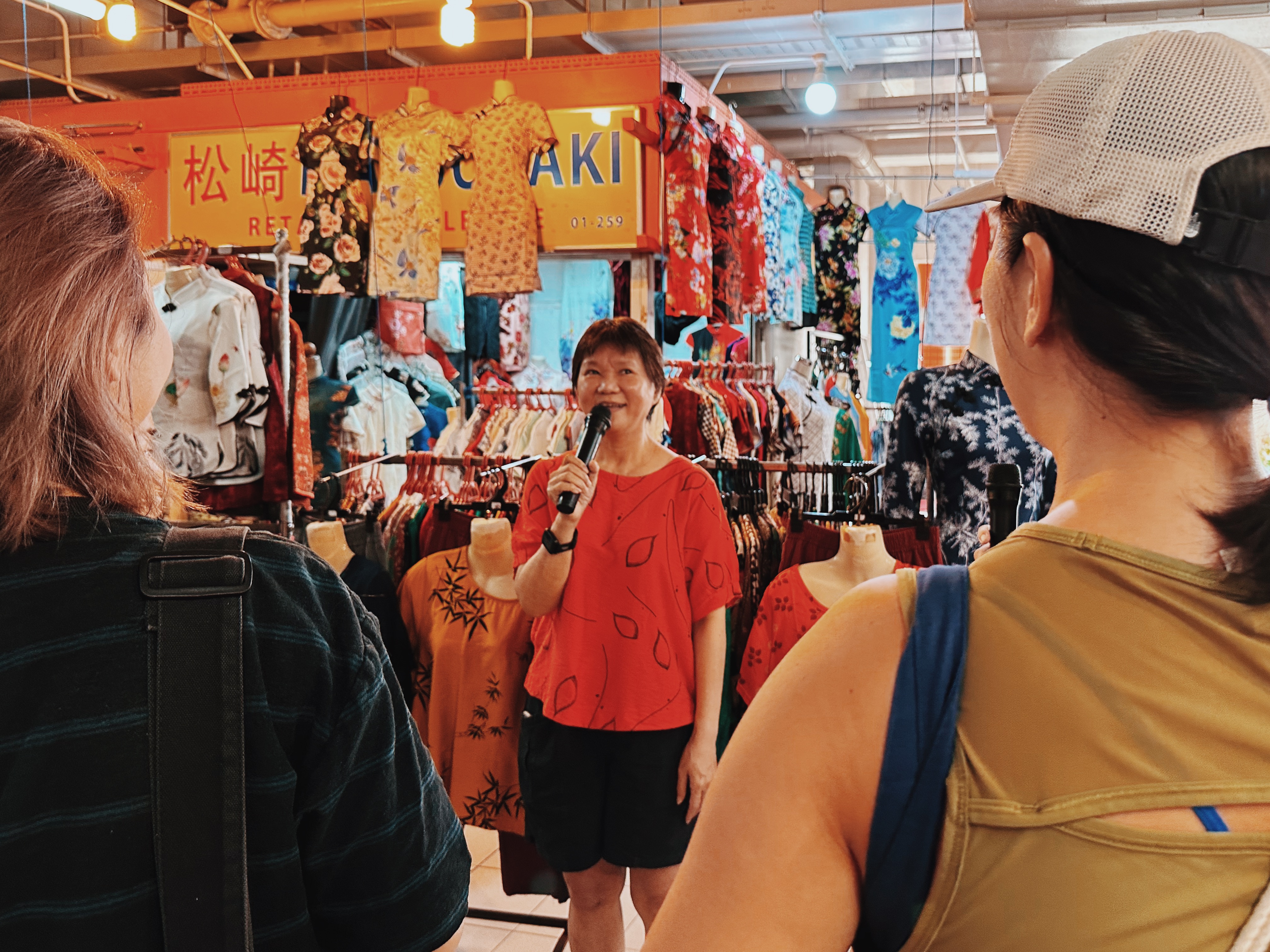 Wide shot of Madam Ang speaking during the tour