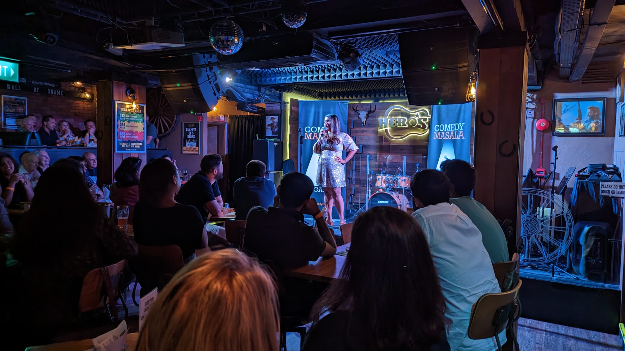 Wide shot of Maitreyi Karanth entertaining a live audience
