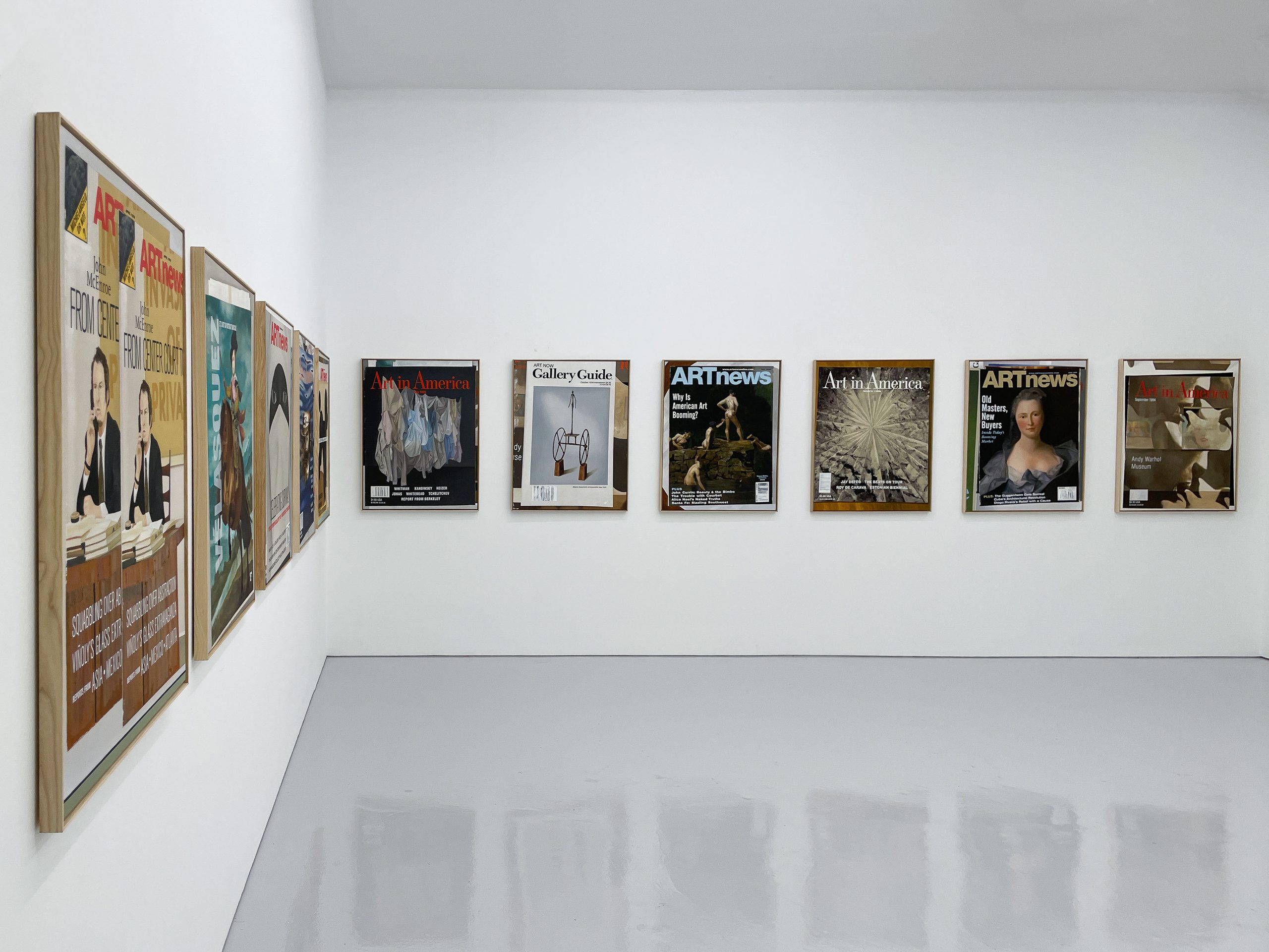 Wide shot of paintings from Historia featured on right-angle walls
