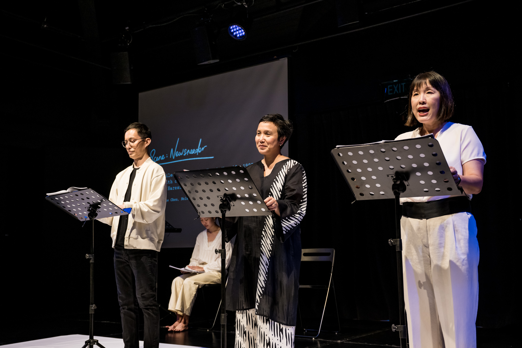 Wide shot of Nelson Chia, Oniatta Effendi, and Serene Chen (left to right) onstage