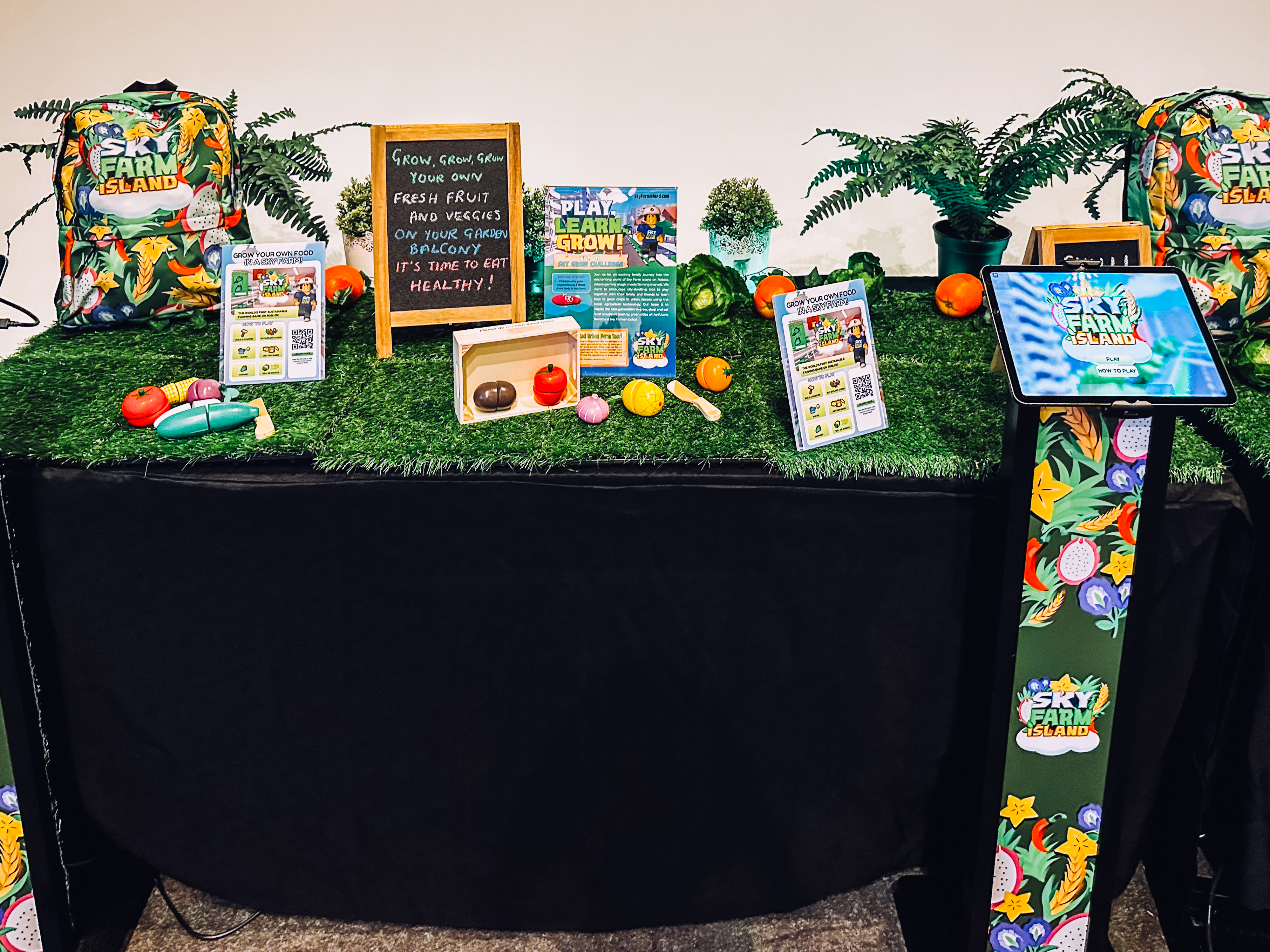 Mid shot of a exhibition table showcasing the game “Sky Farm Island” at the MeshMinds 3.0: ArtxTechforGood exhibition 