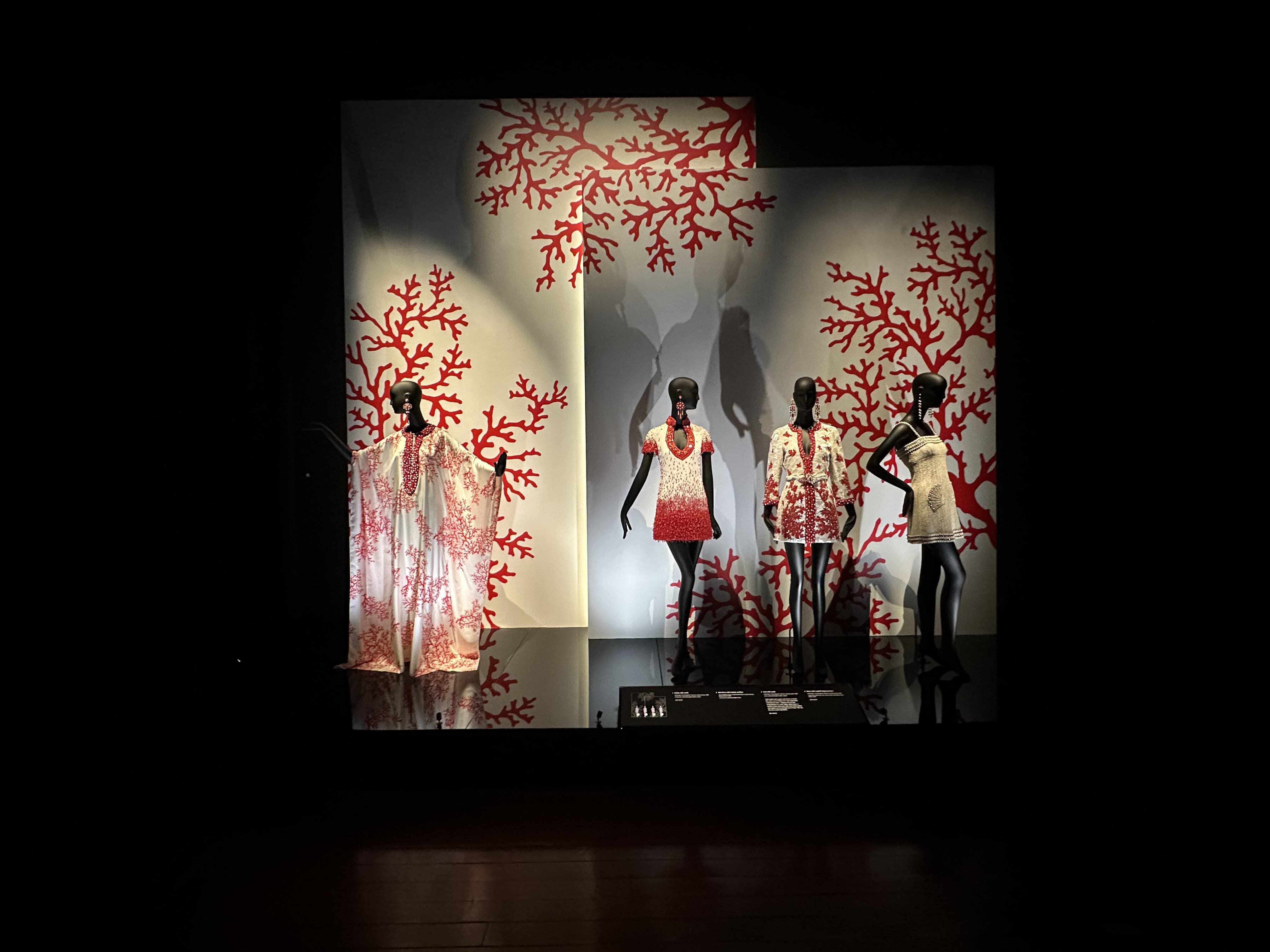 Wide shot of designs in red and white on display 