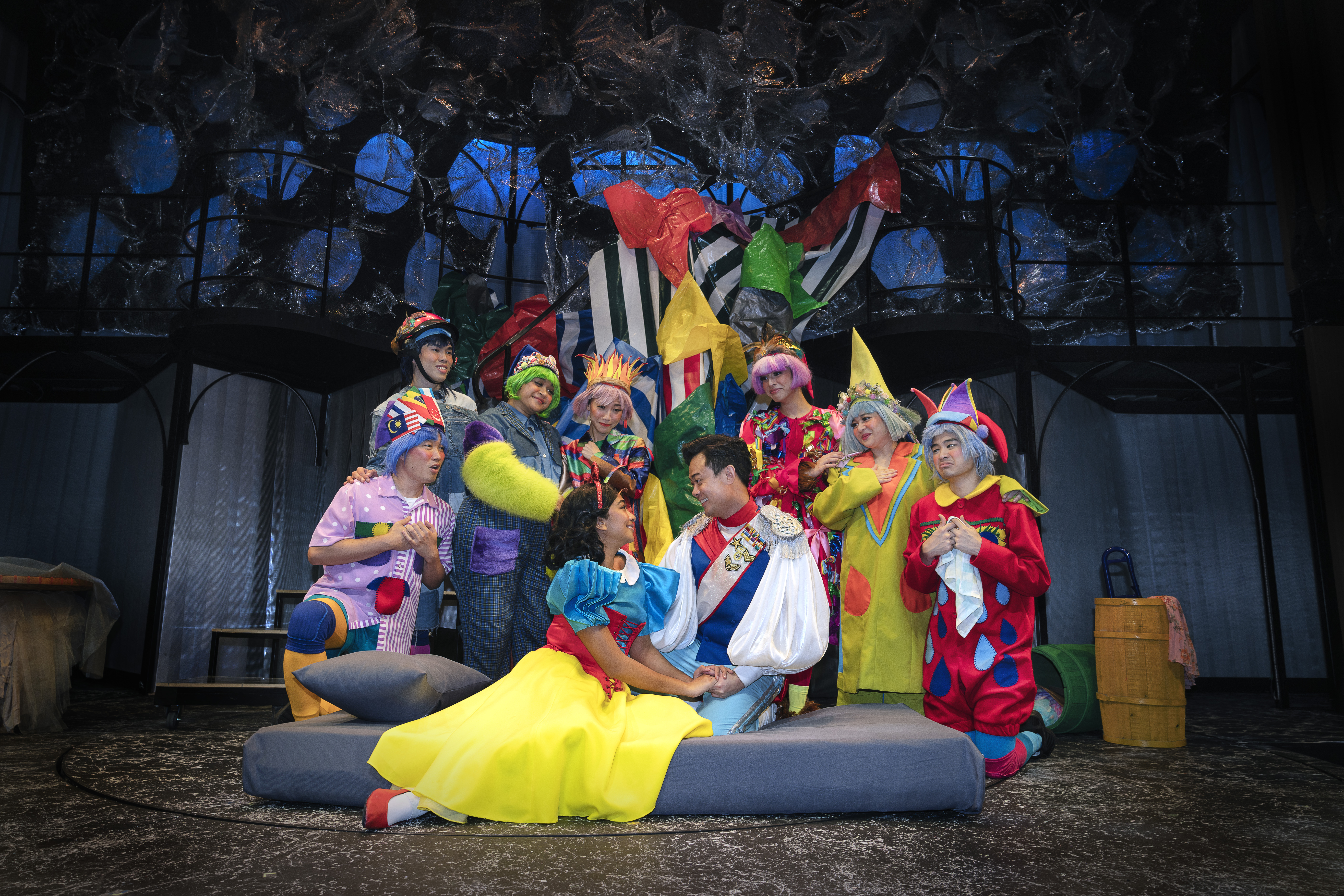 Wide shot of the cast of Snow White and the Seven Dwarfs performing onstage