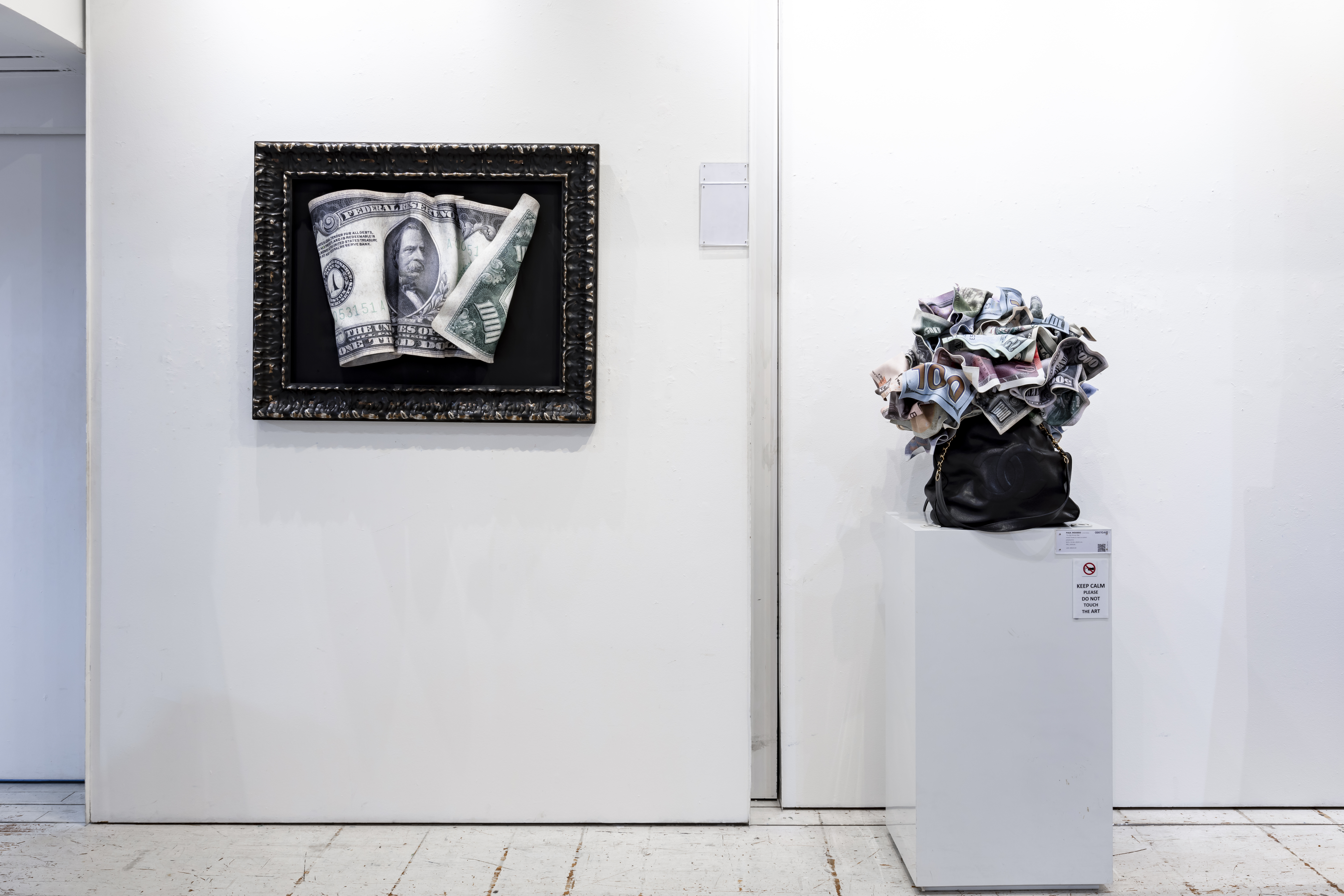 ide shot of exhibition pieces Winner’s Purse and The Big Money Bag in Power of Paper