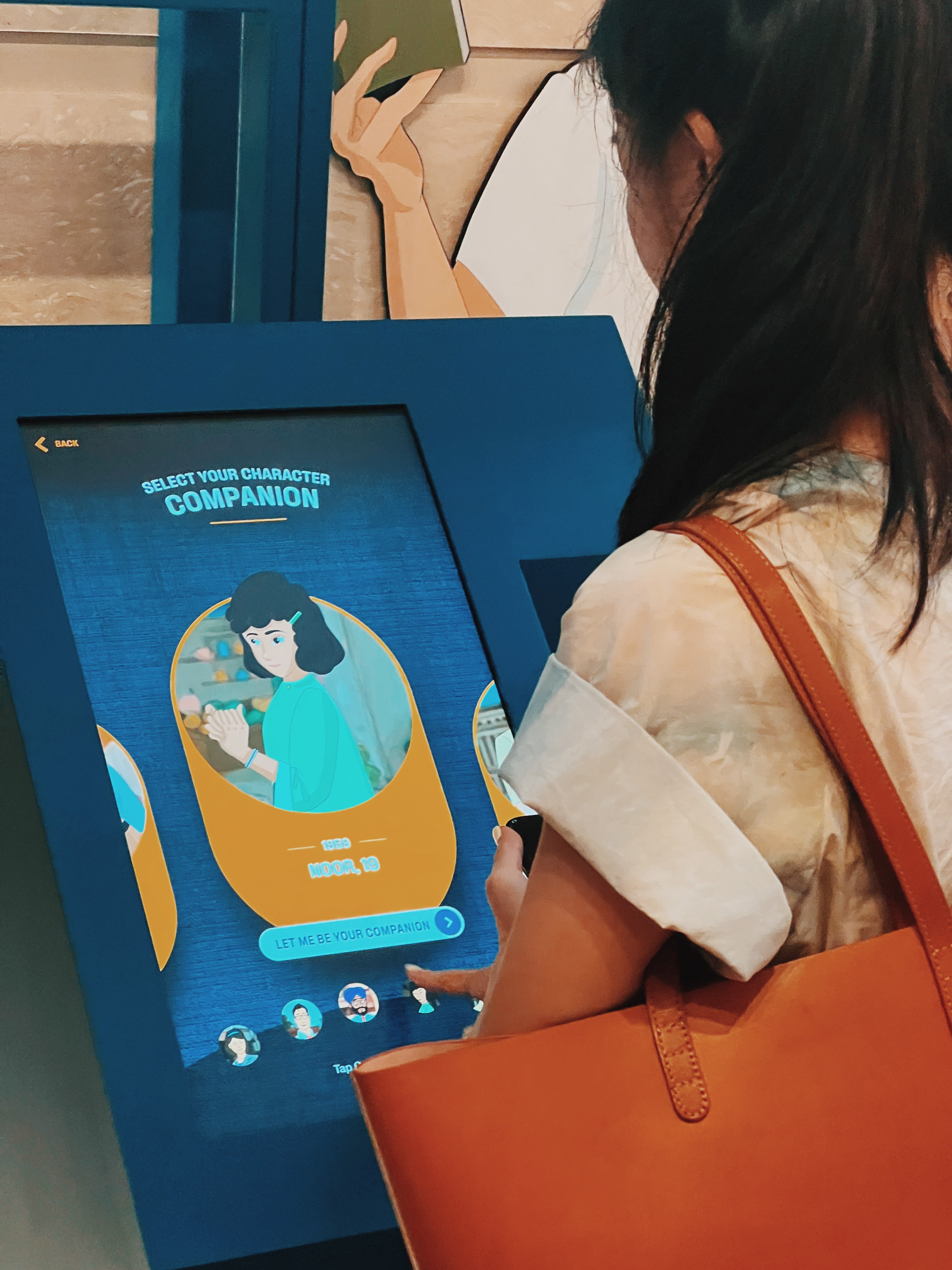 Close-up shot of a woman interacting with an exhibition display