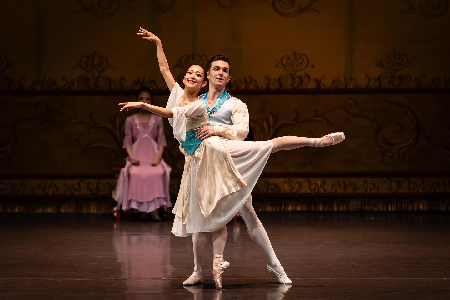 Two performers onstage in mid-performance at Ballet Under The Stars 2023