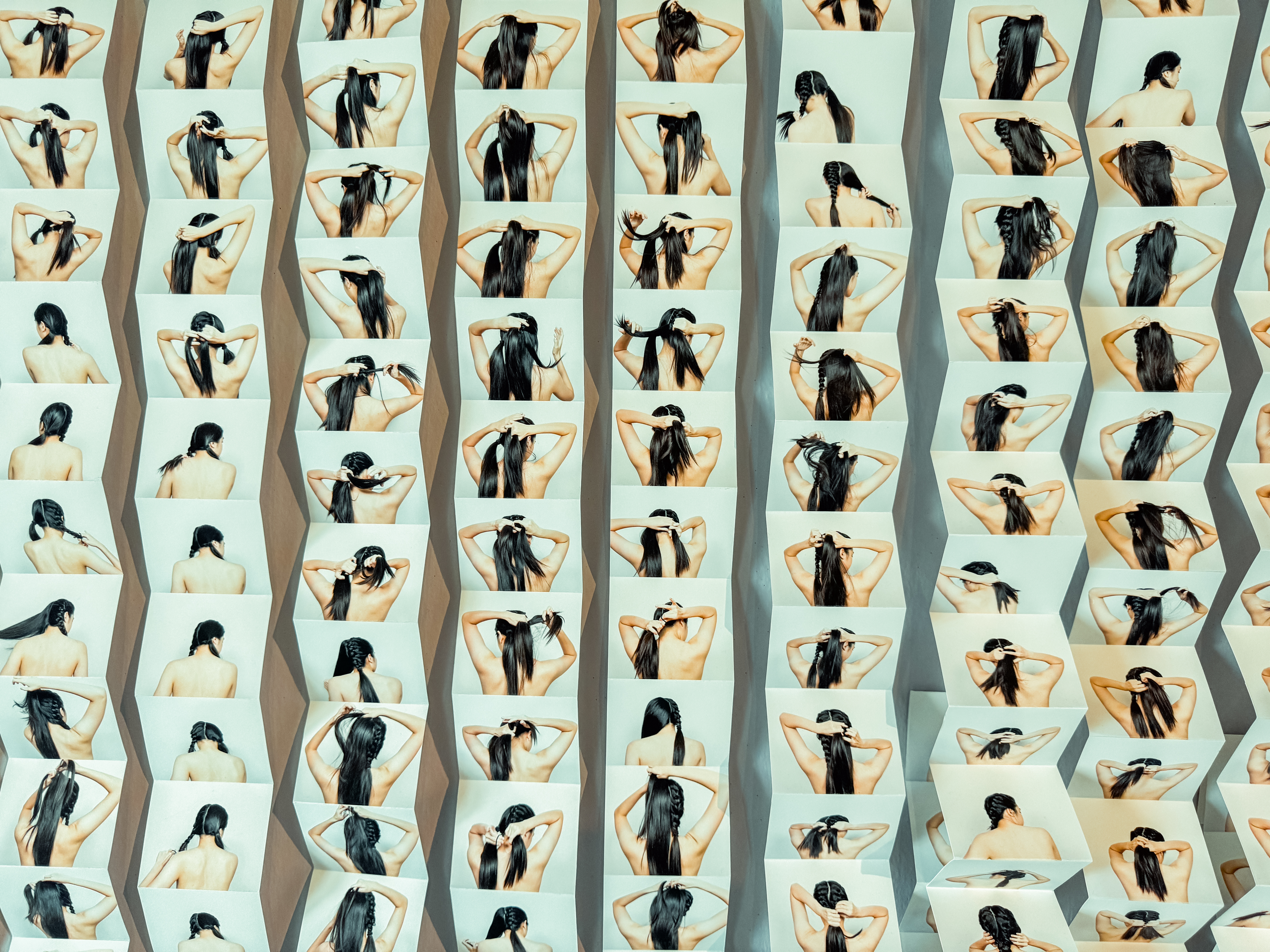 Wide shot of multiple strips of images showcasing a woman braiding her hair