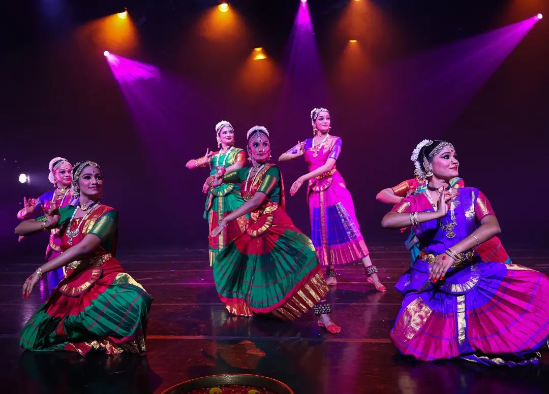 Wide shot of Indian dancers performing on stage