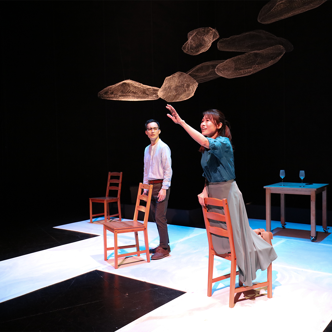 Wide shot of two performers from Nine Years Theatre onstage