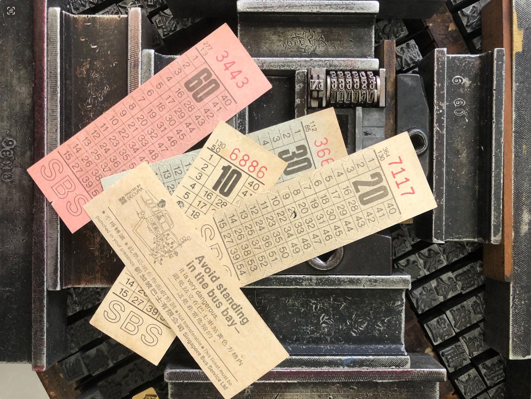Overlay shot of old-school bus tickets