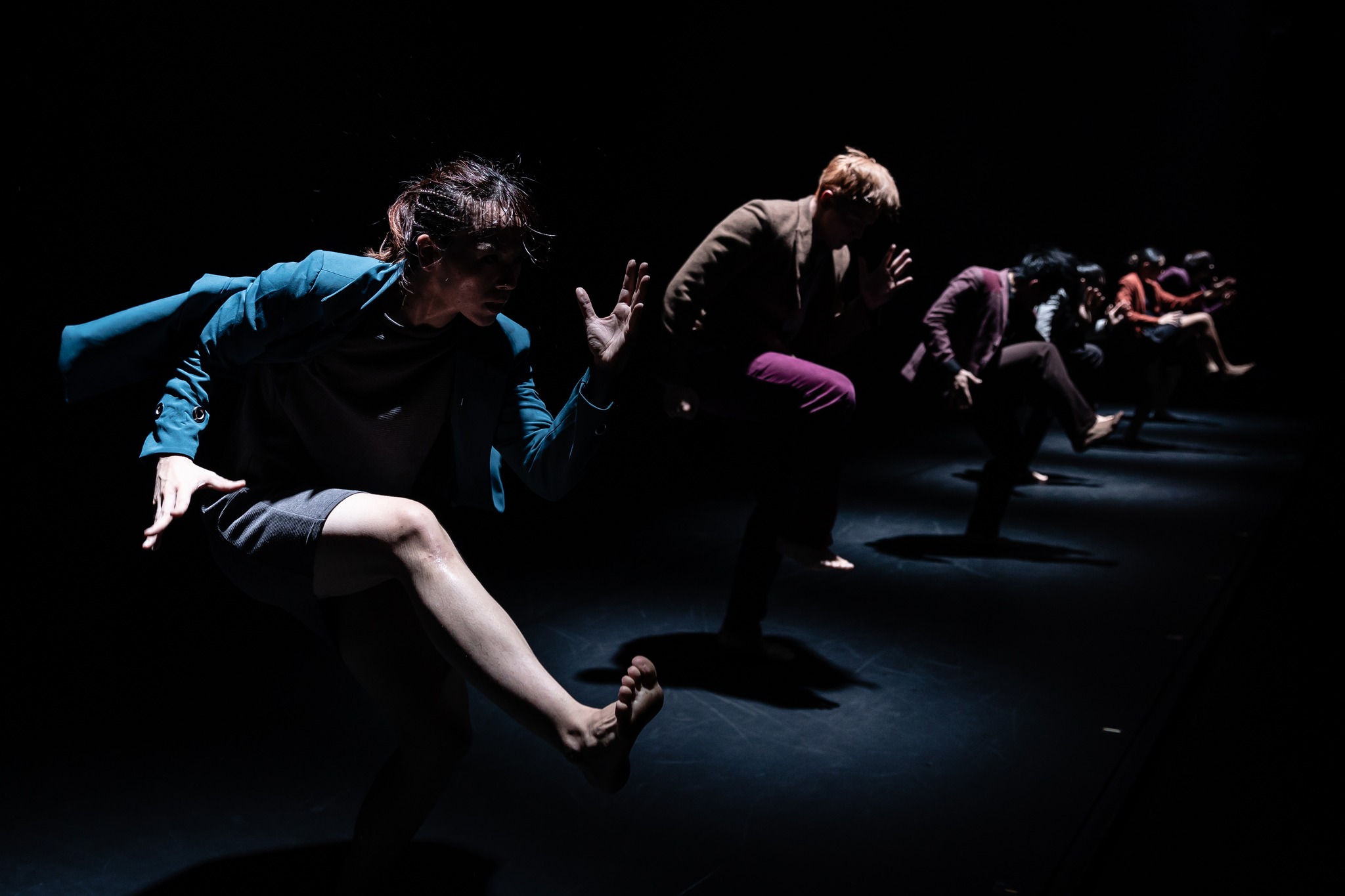 Wide shot of a row of dancers from T.H.E. Dance Company